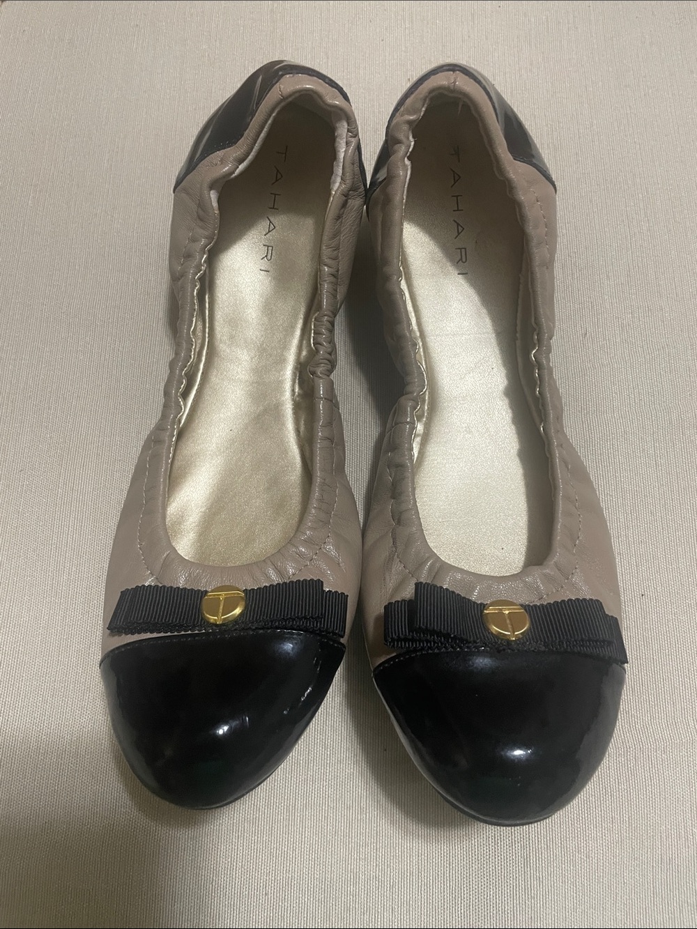 Tahari Taupe and Black Cap-Toe Bow Ballet Flats